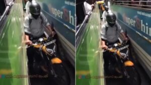 Biker Attempts Dangerous Stunt Between Buses, Users React: 'No Limit to Foolishness | Watch