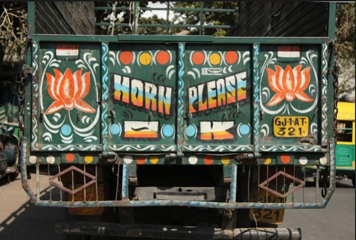 Behind the Phrase: The Significance of 'Horn OK Please' on Indian Trucks.