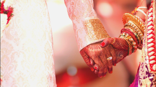 Couple gets married in a police station while their families fight over food shortage