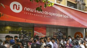 Customers queue outside New India Co-operative Bank as RBI imposes limits on fund withdrawals