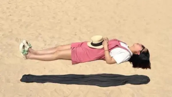 Viral Beach Photo of 'Floating Woman' Leaves Internet Baffled — But There's a Clever Twist