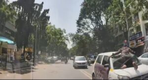 Pune Roads in Turmoil: Man Hangs Onto Car Windshield in Viman Nagar While Political Rally Triggers Citywide Traffic Woes