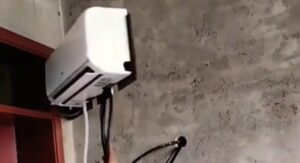 Creative Genius! Man Invents Swiveling AC Hack That Cools Two Rooms & Slashes Electricity Bills – Watch the Viral Video