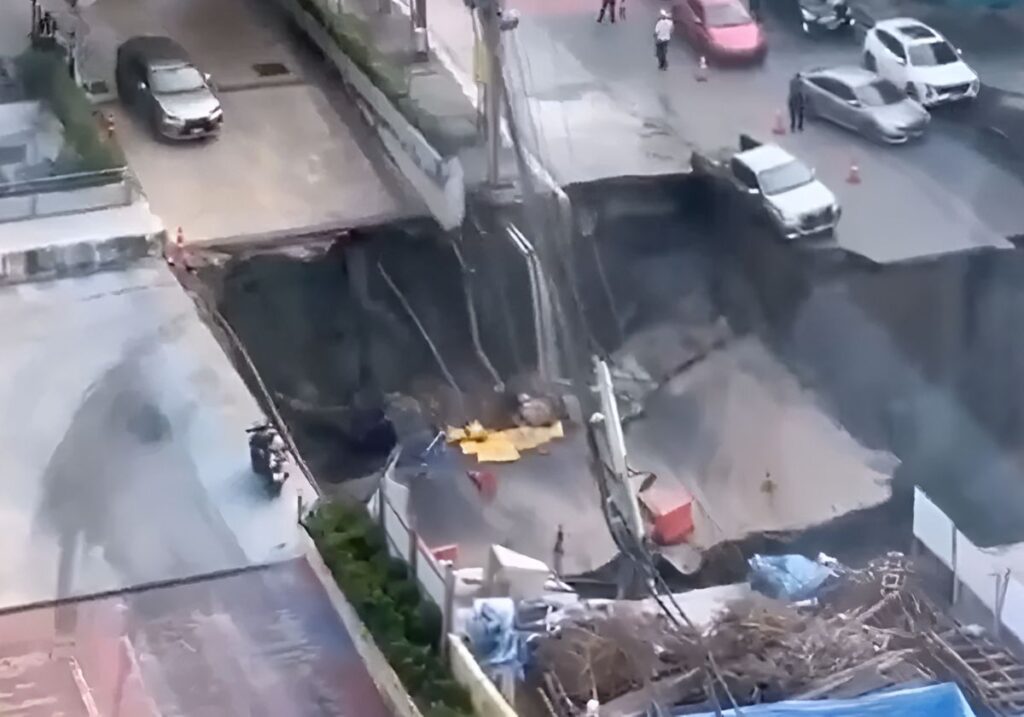 Massive 50-Metre Sinkhole Opens in Bangkok, Swallows Car and Power Poles – Shocking Video Goes Viral