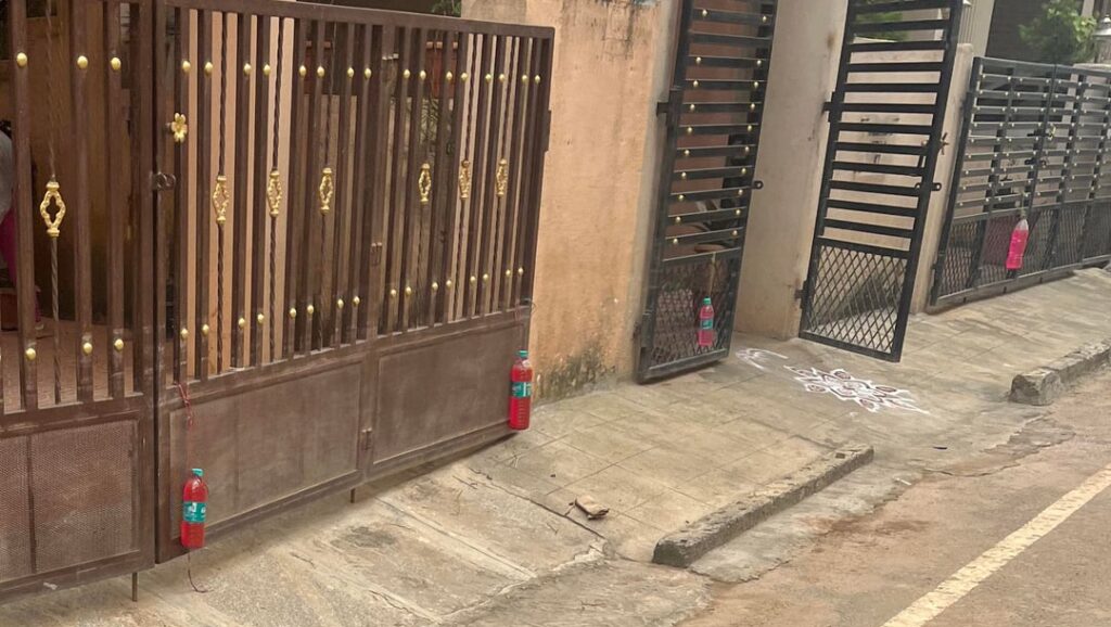 Why Many Residents Are Hanging Red Bottles Outside Their Homes to Ward Off Stray Dogs