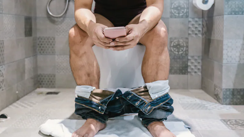 Using Your Phone in the Bathroom? Doctors Say You Might Regret It